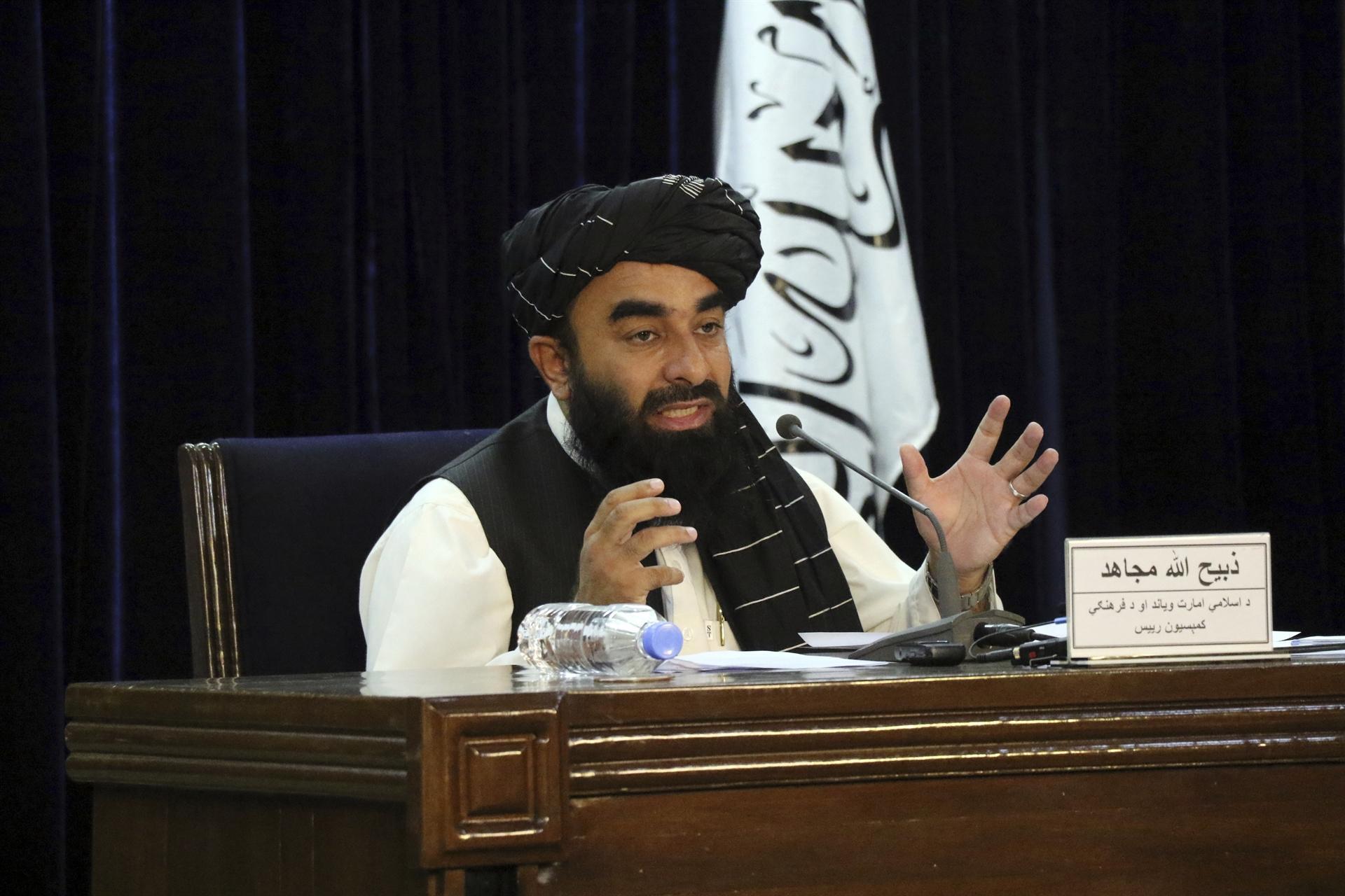 Taliban announce hardline government as protests grow