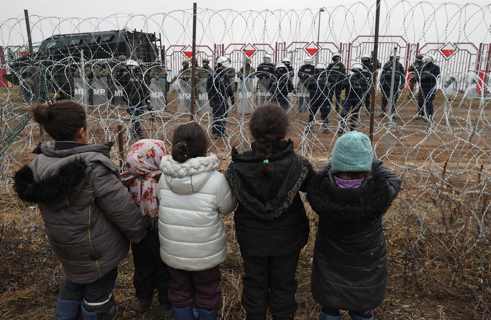 Belarus brings some migrants in from cold at Polish border