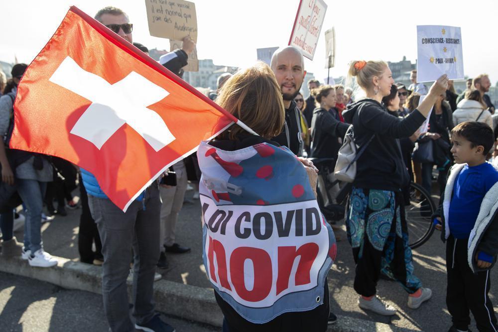Swiss vote on COVID law amid sharp rise in infections