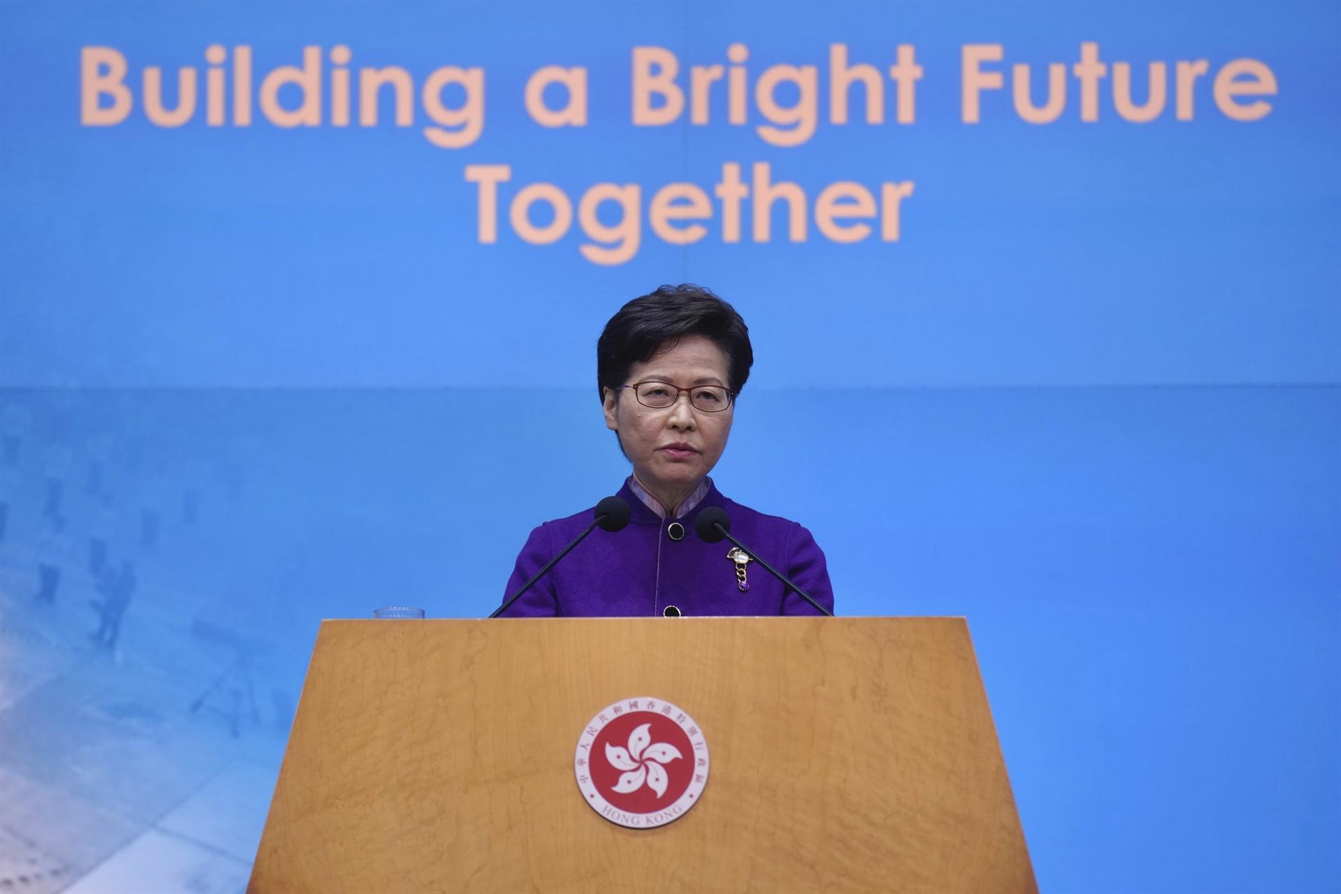 Hong Kong leader hails patriots only vote despite record low turnout