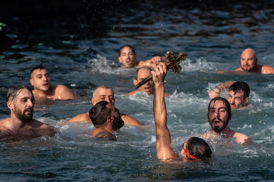 Orthodox Christians mark Epiphany with dive for cross
