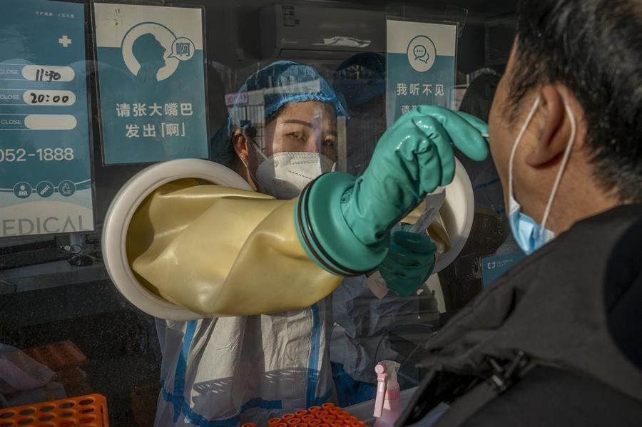 China locks down third city, raising affected to 20 million