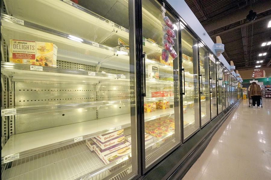 US shoppers find some groceries scarce due to virus, weather