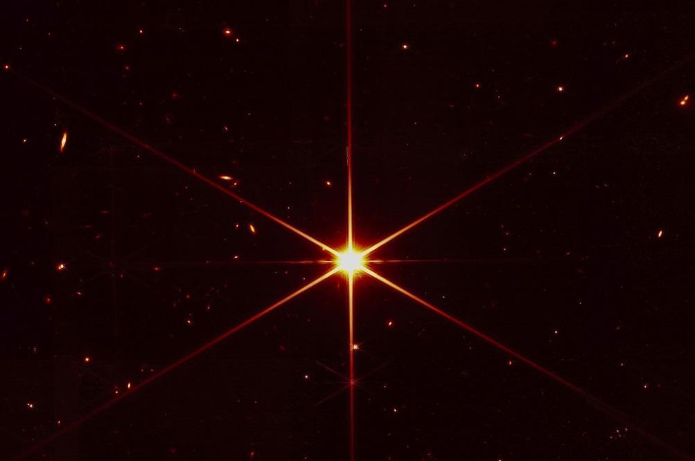 Space telescope’s image of star gets photobombed by galaxies