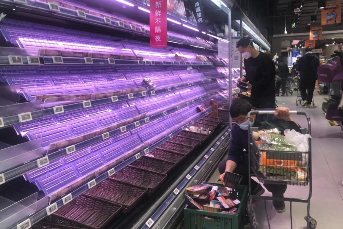 Shanghai wrestles with food shortages under virus shutdown