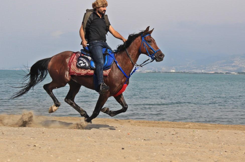 Man rides horse to work