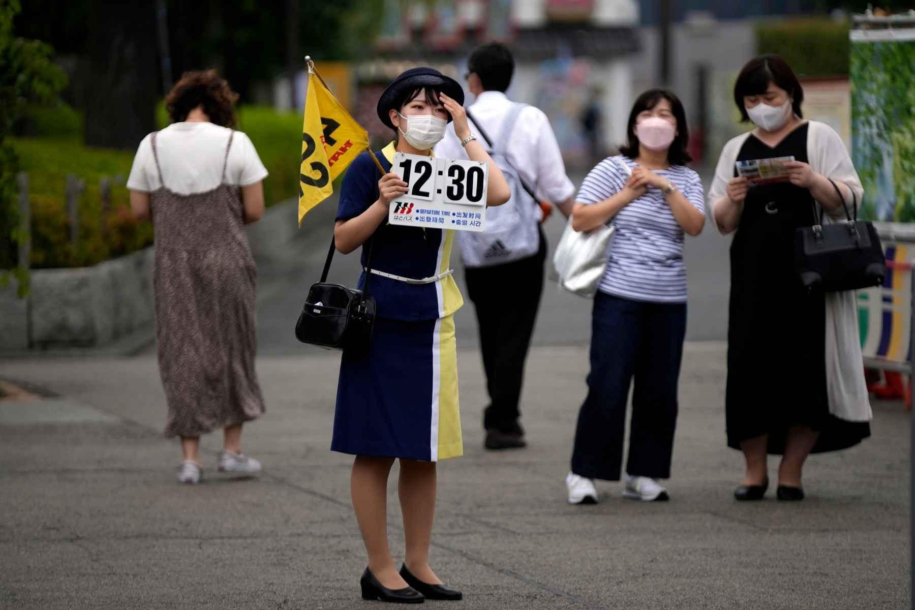 Japan eases foreign tourism ban, allows guided package tours