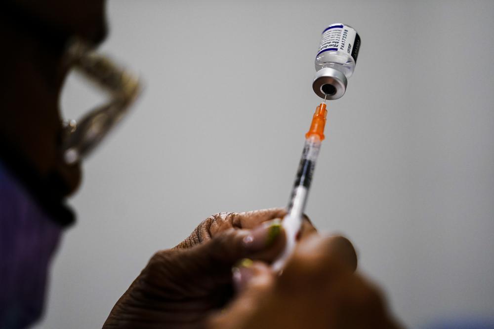 Australia offers fourth Covid shot to over-30s