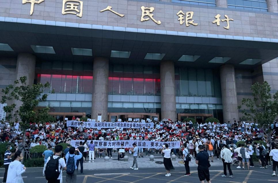 China detains alleged bank fraud ‘gang’ after rare mass protests