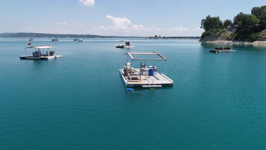 Shanties on pontoons on Seyhan Lake Dam rented for $40 daily