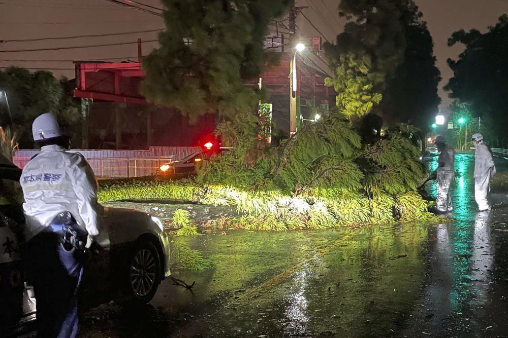 Storm floods parts of Japan, wipes out power, dozens hurt