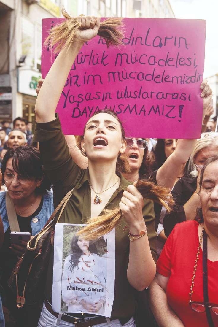 Woman cuts hair at Istanbul protest for Iran’s Amini