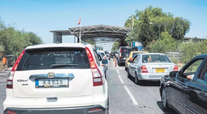 Greek Cypriot drivers fill up in north as prices soar