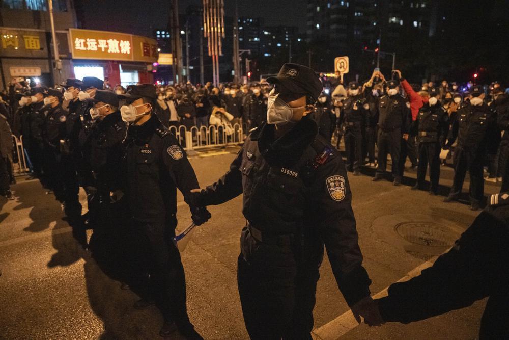 Police detain two people at Shanghai protest site: AFP