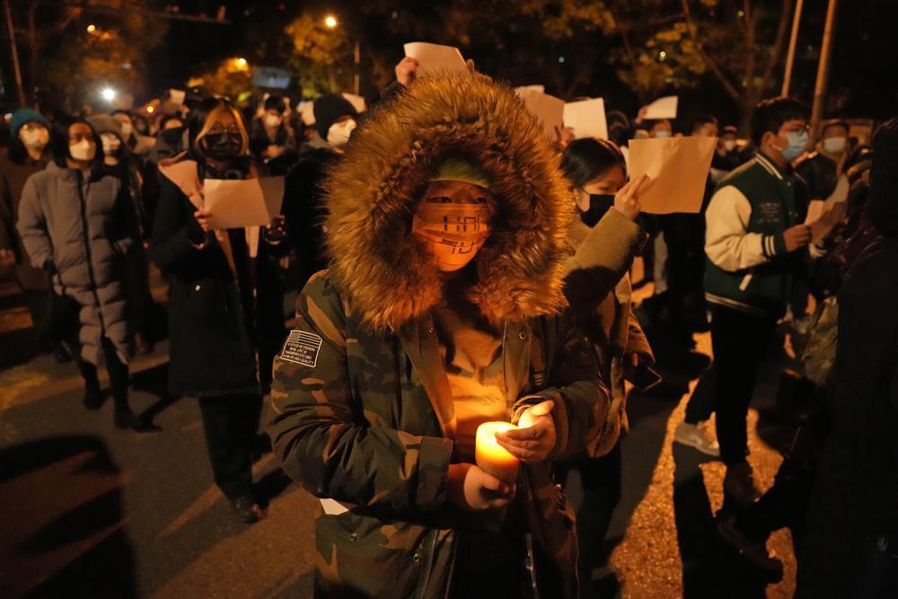 China eases COVID rules after protests, keeps wider strategy