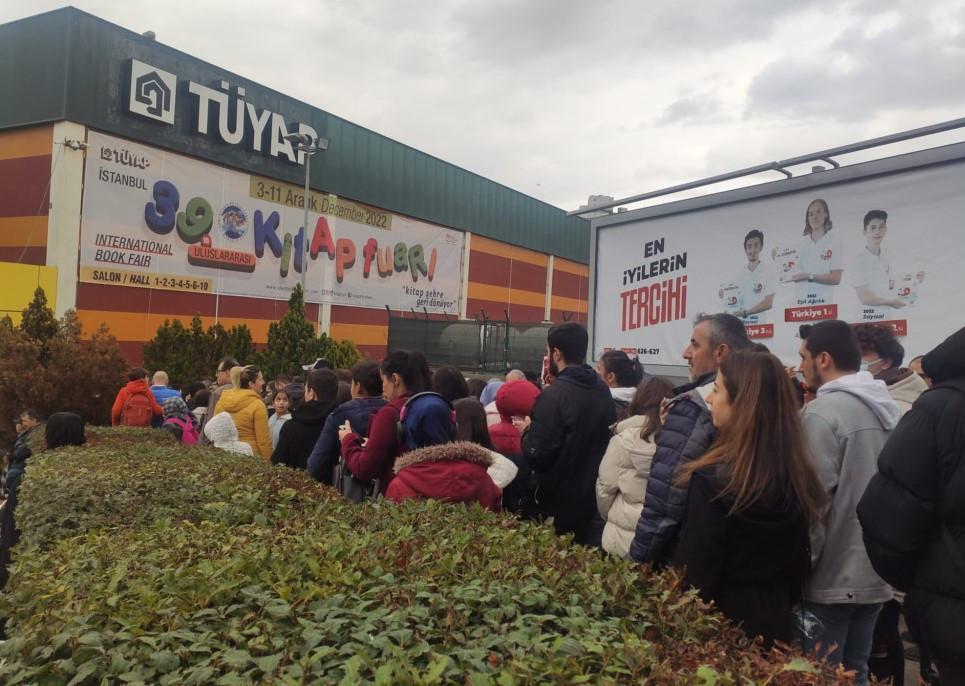 Visitors wait in long queues to enter book fair