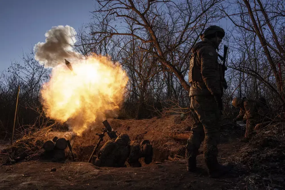 Battle rages in Ukraine town; Russia shakes up its military