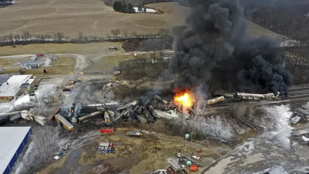 US cargo train derails, causing huge fire