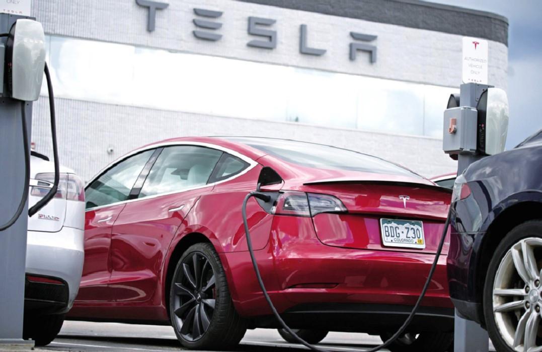 Tesla profits fall on vehicle price cuts