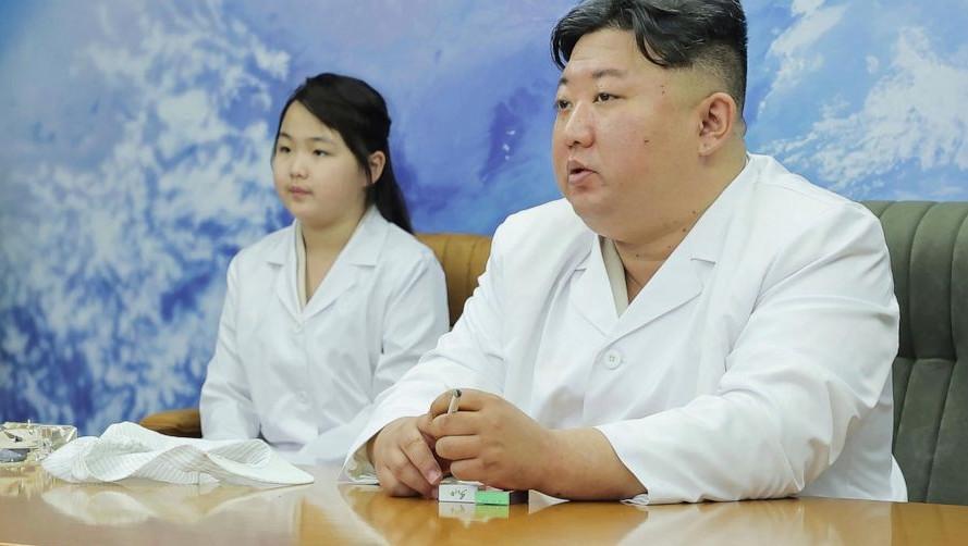 North Korea shows Kim Jong Un examining a military spy satellite