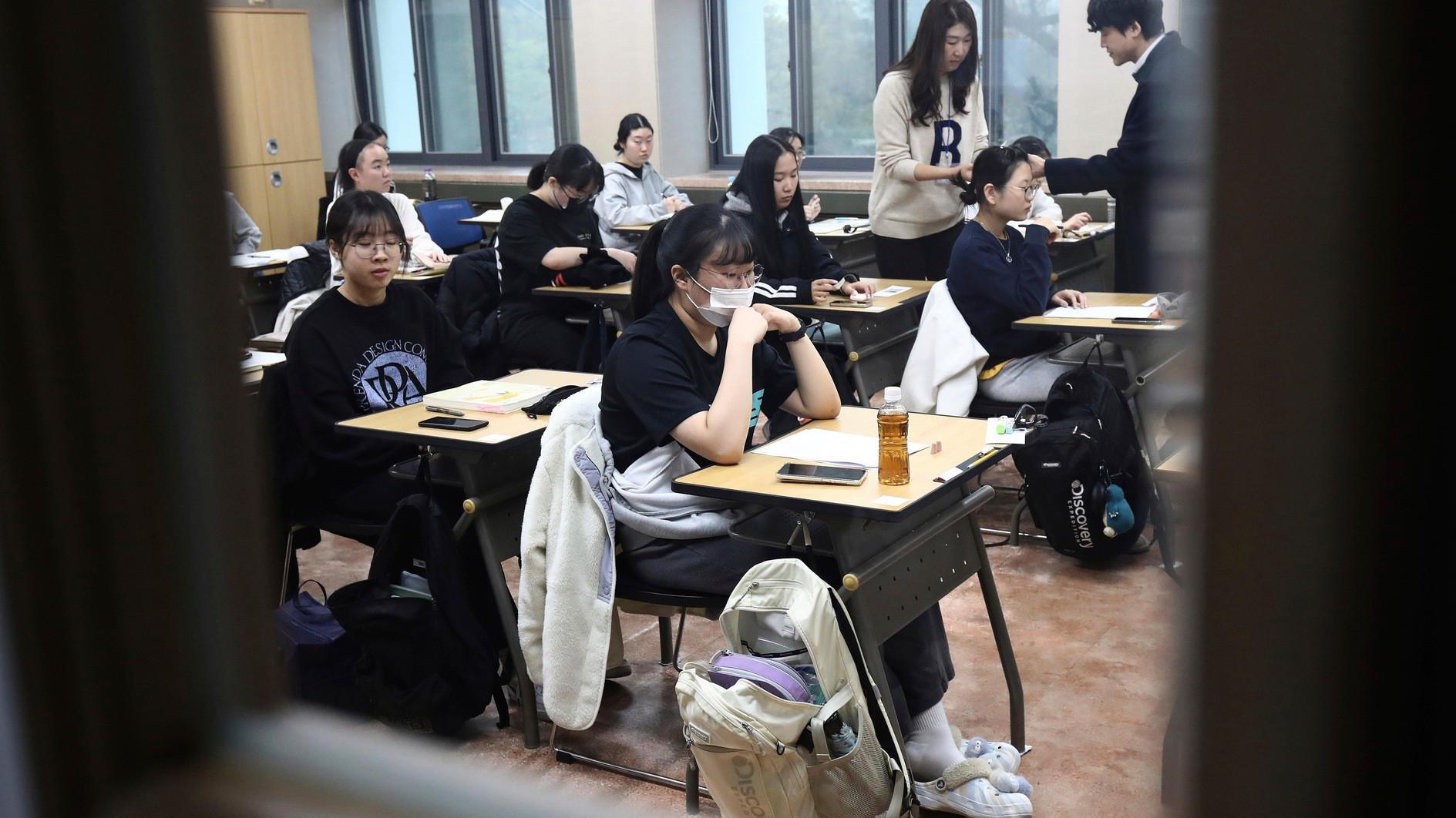 South Koreans sit key exam as flights halted to limit distraction