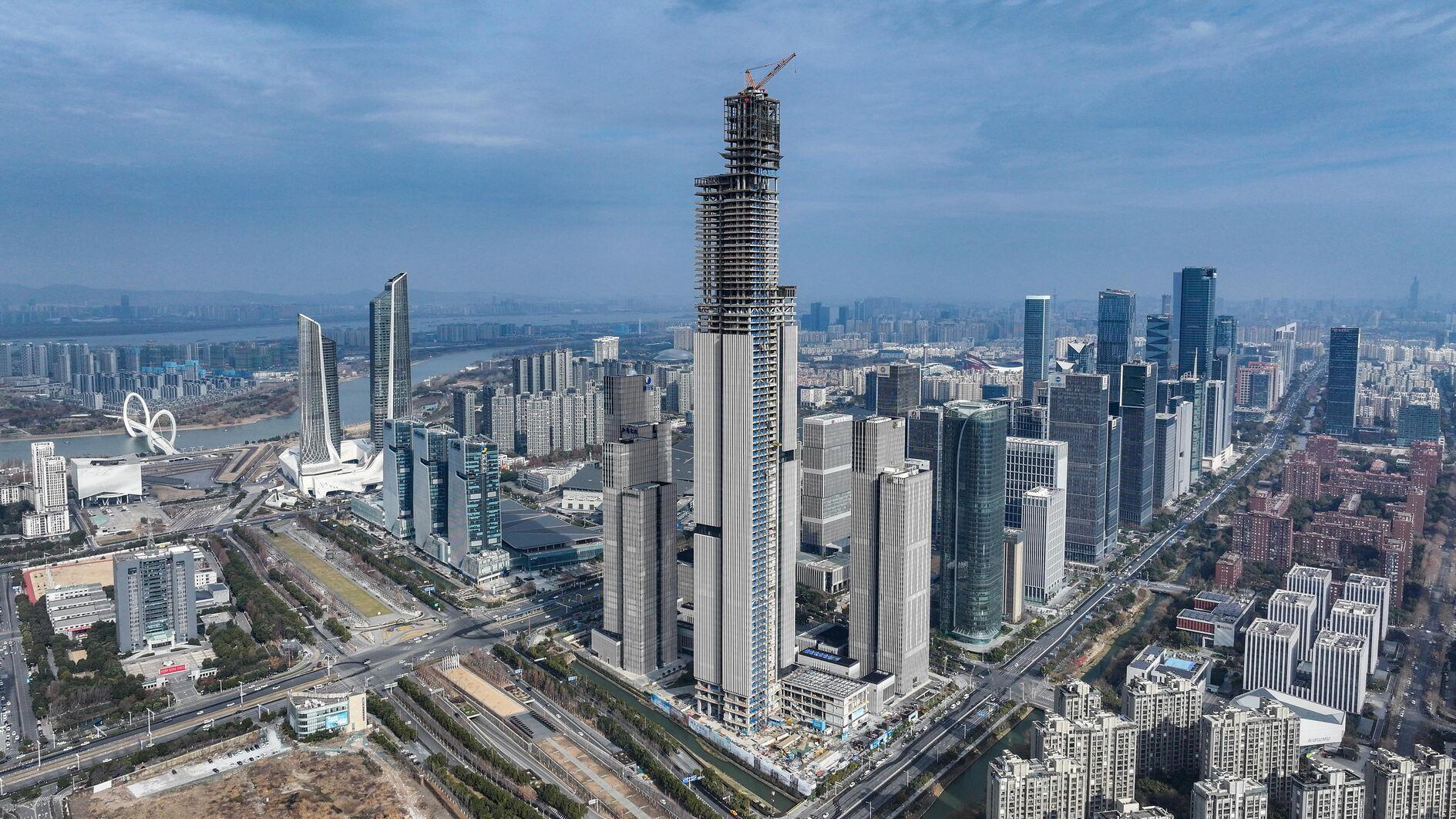 China cuts rates, could buy up commercial housing to boost property market