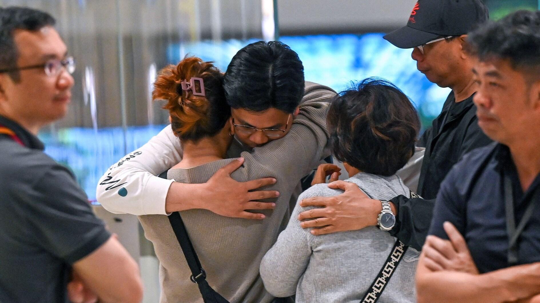 Relieved travellers land in Singapore after deadly turbulence