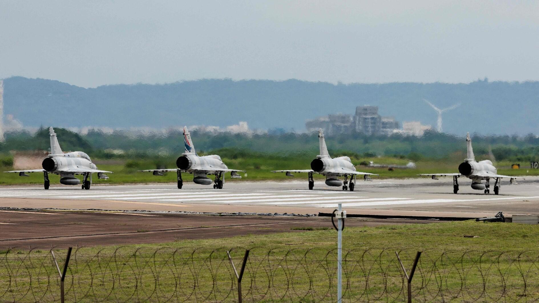 China holds war games around Taiwan, vows flowing blood