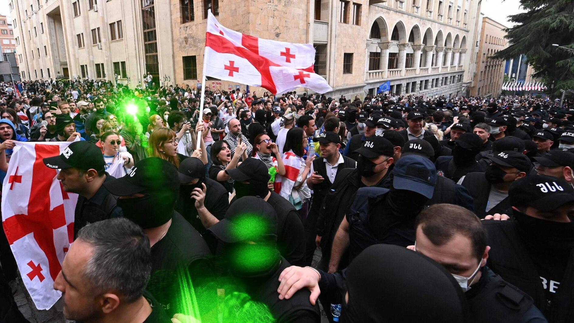 Georgia NGOs vow to defy influence law as thousands rally to protest