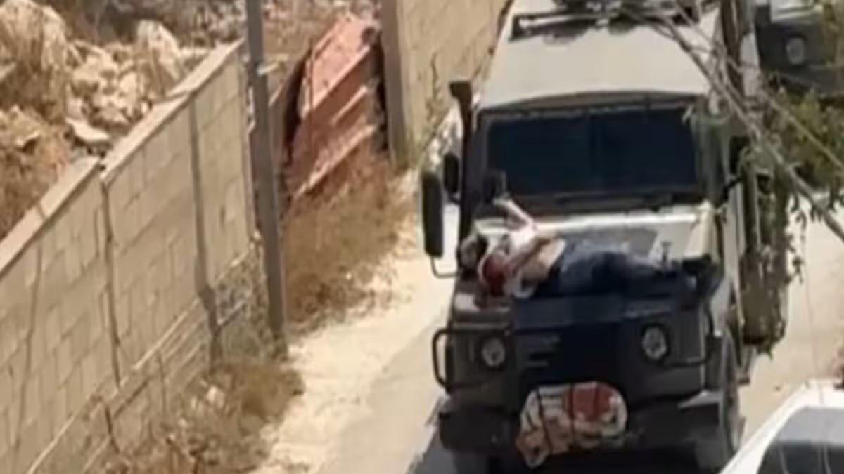 Israeli forces tie wounded Palestinian to jeep in West Bank raid