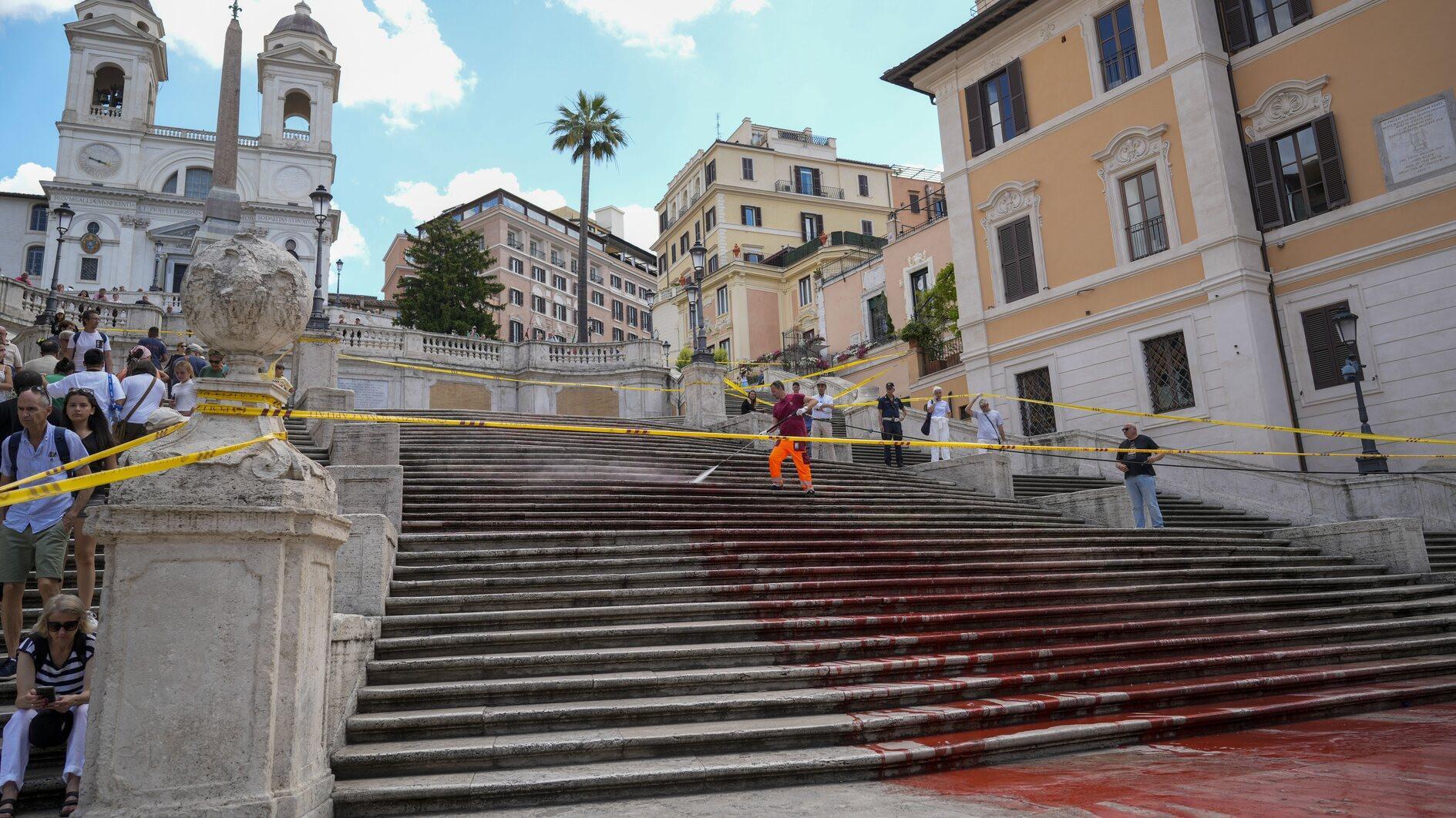 Womens rights activists paint Romes Spanish Steps red