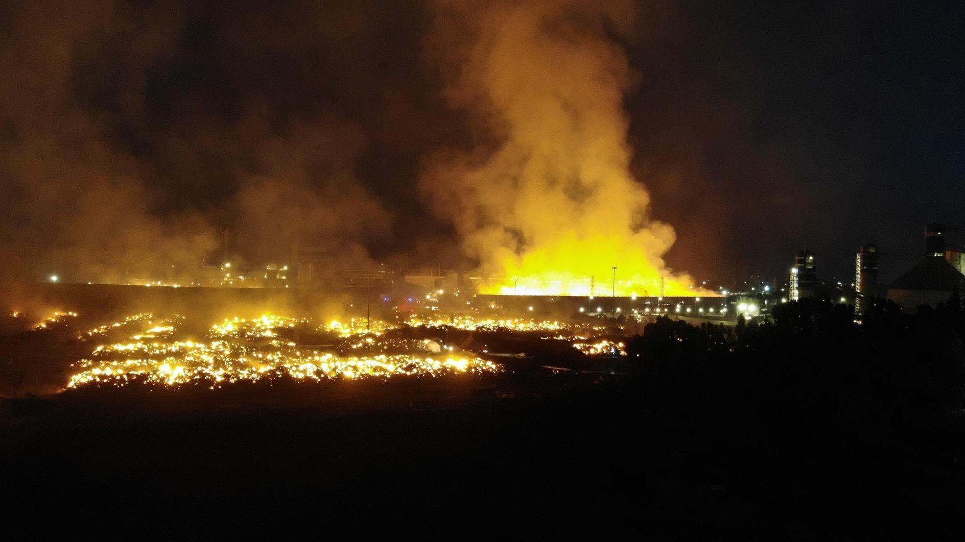 Flames ravage paper factory in western city for days