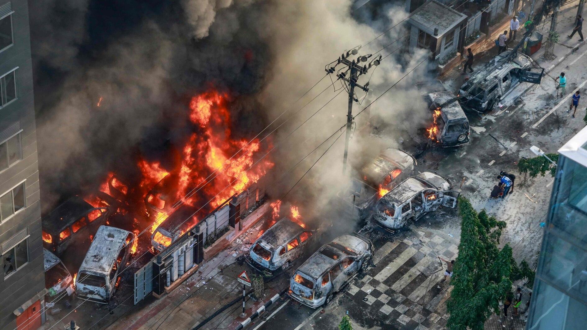 Bangladesh wakes to torched government buildings, internet blackout