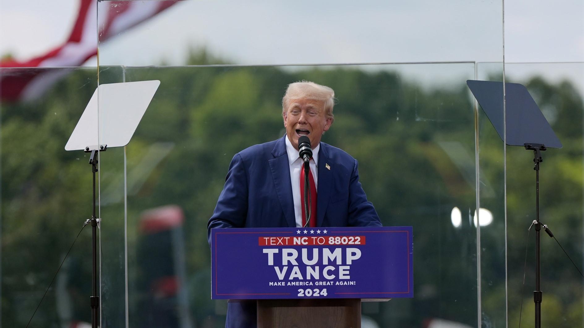 Trump speaks from behind bulletproof glass