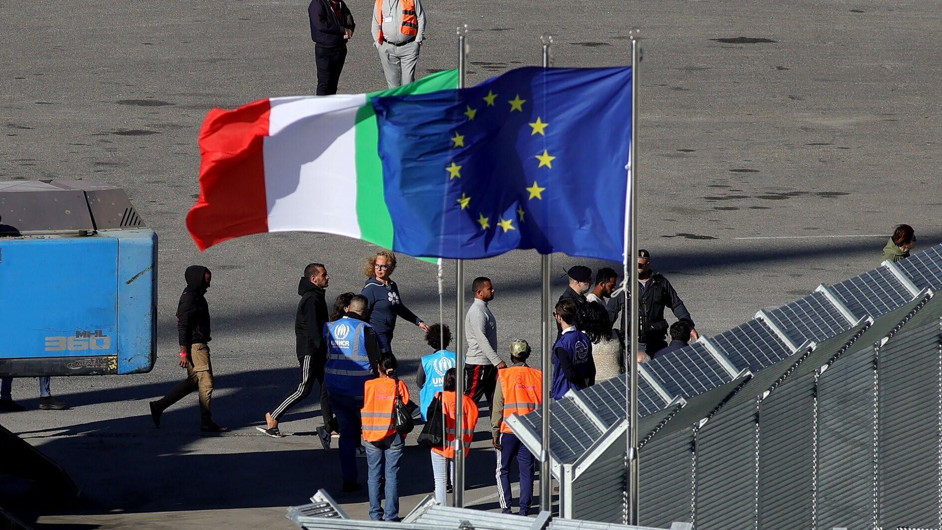 Italian navy brings first migrants to Albania under asylum deal