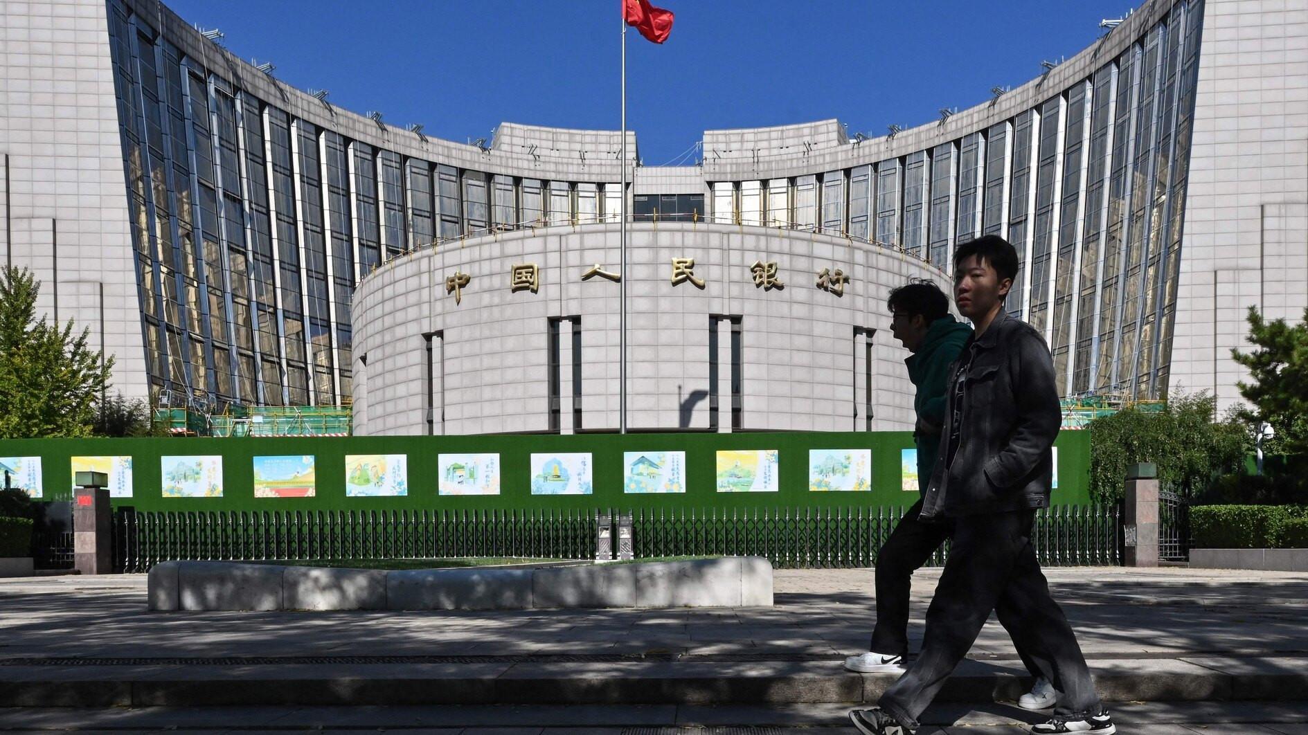 Chinas central bank cuts two key rates to boost economy