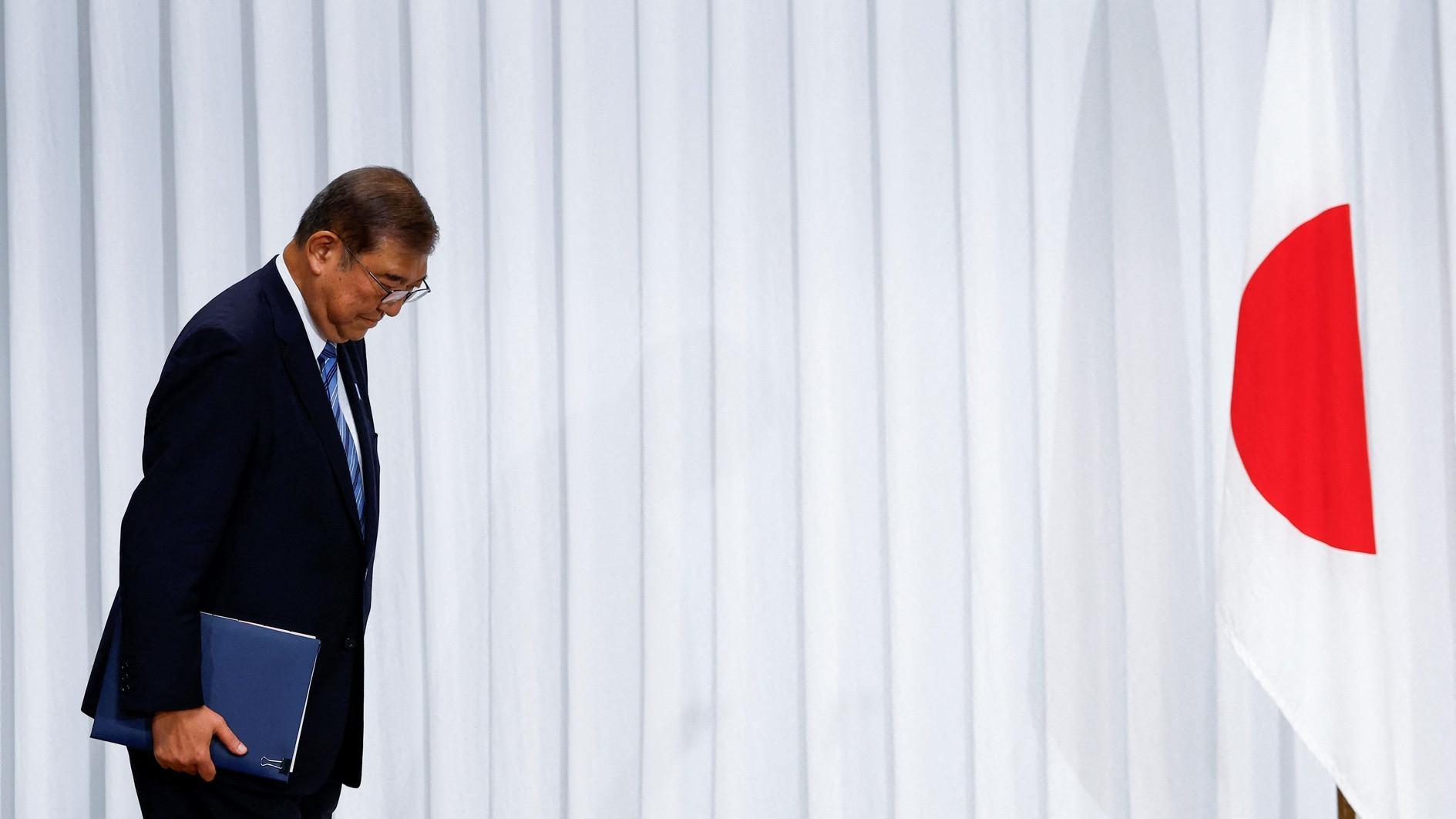Japan PM vows to stay on despite election debacle