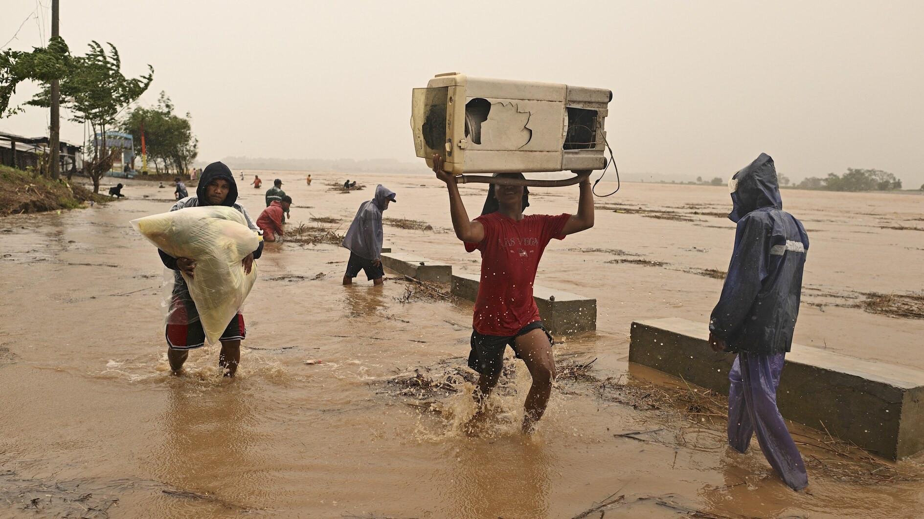 Thousands flee as fourth typhoon in a month hits Philippines