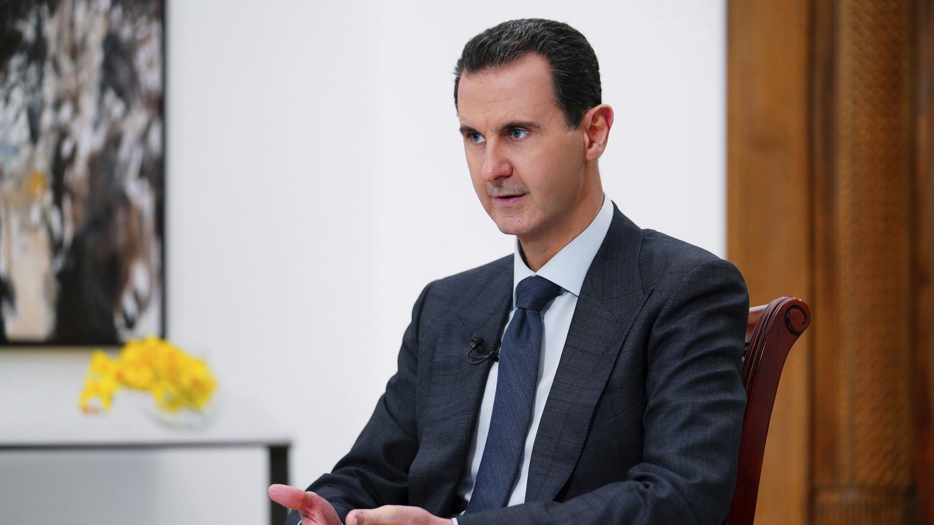 Assad says he had no plans to leave, but Russians evacuated him