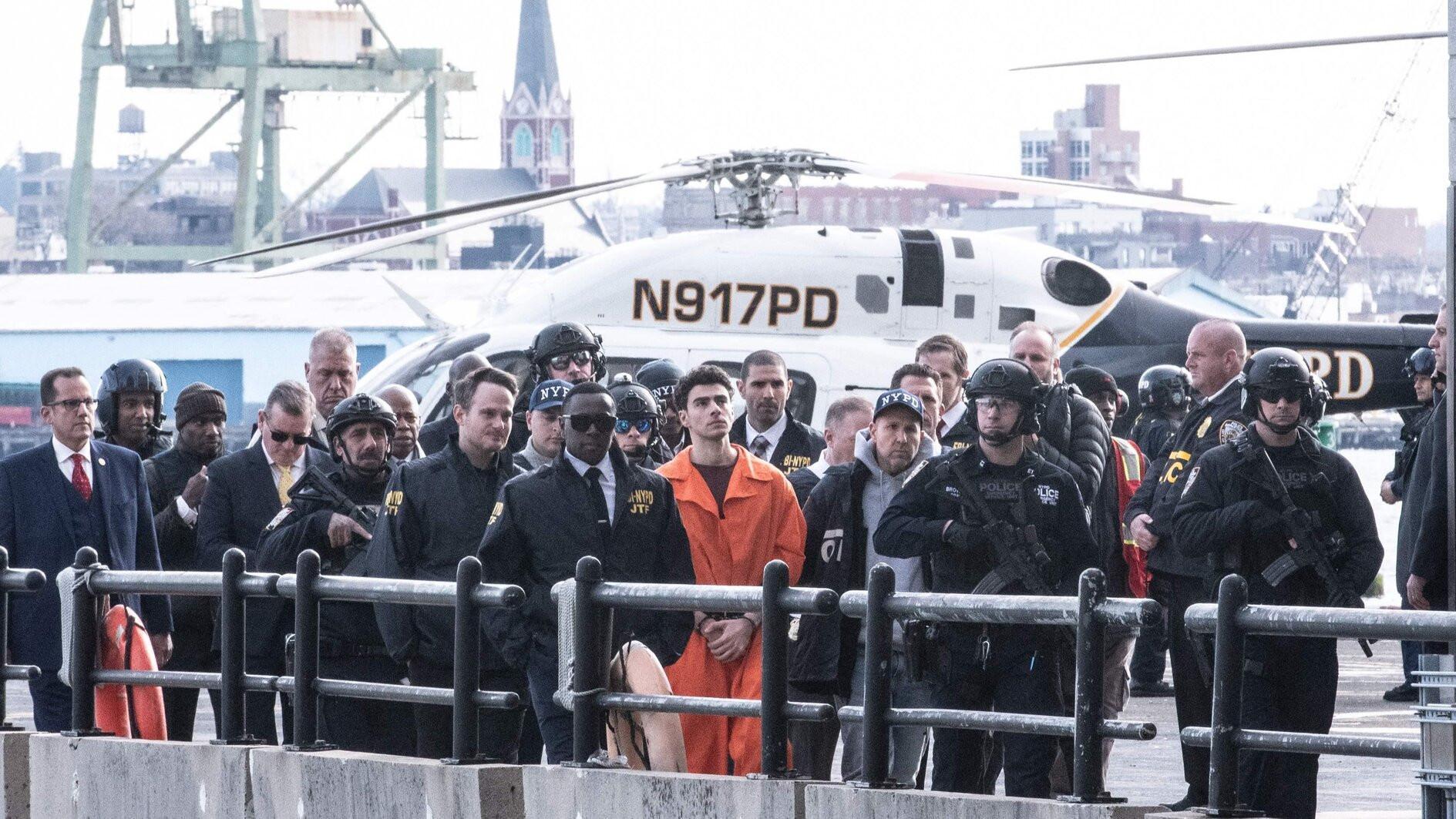 Suspect in health CEO killing charged with murder in New York