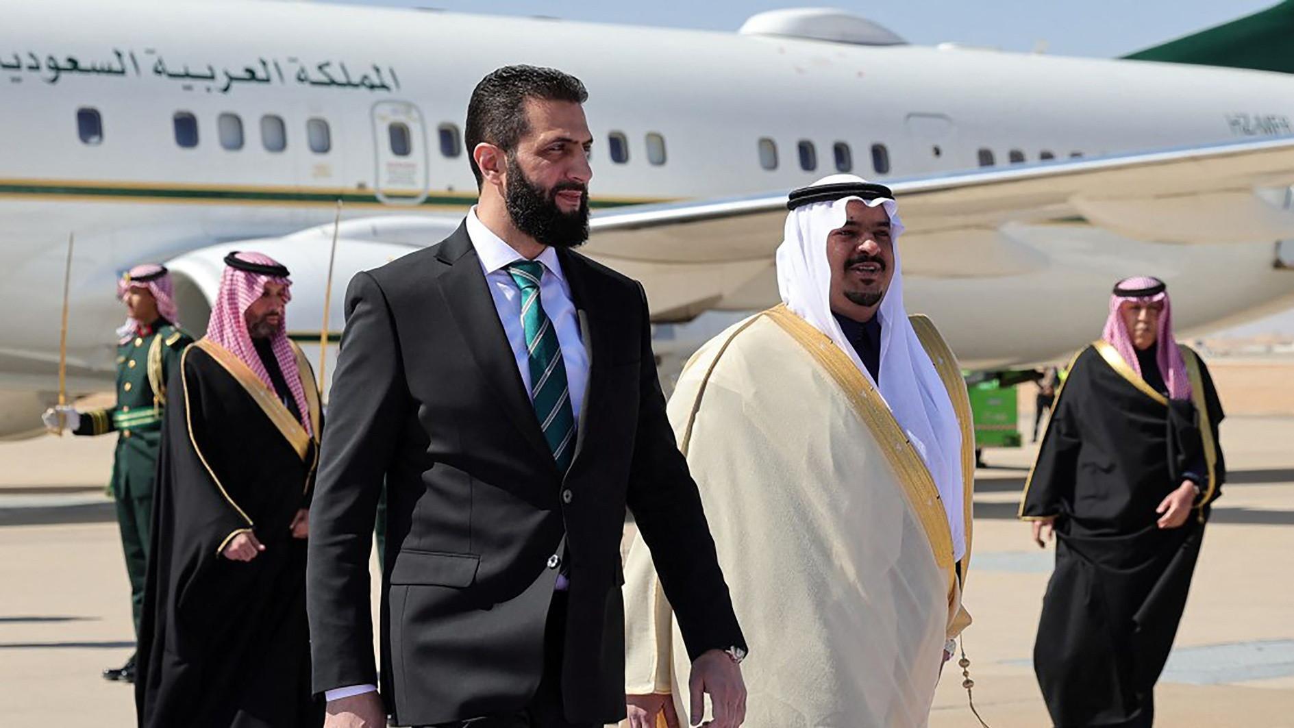 Syrias interim president makes 1st foreign visit to Saudi Arabia
