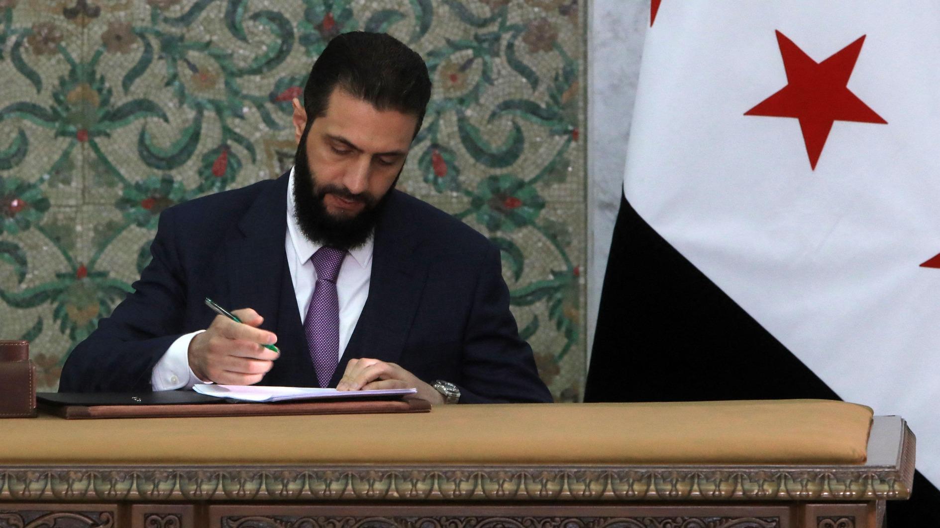 Syria leader signs constitutional declaration, hailing new history
