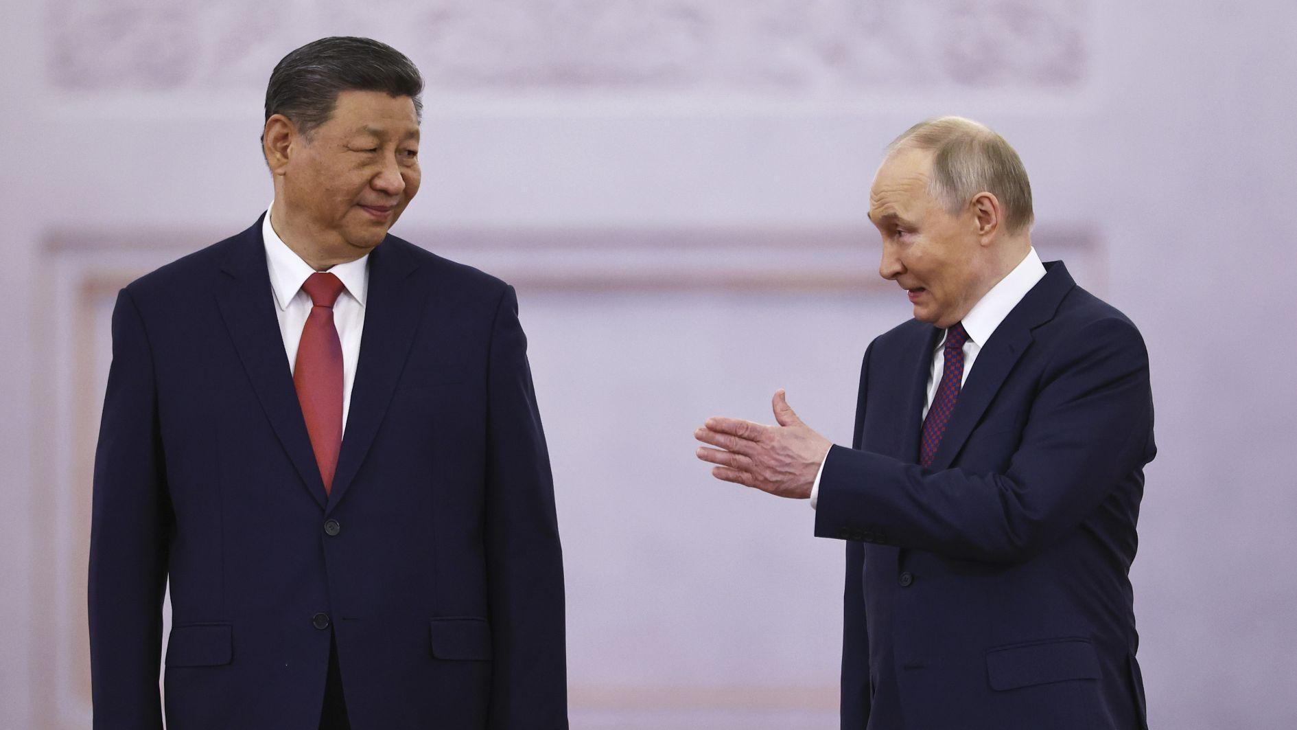 Xi meets Putin in Moscow as Ukraine reports truce violations