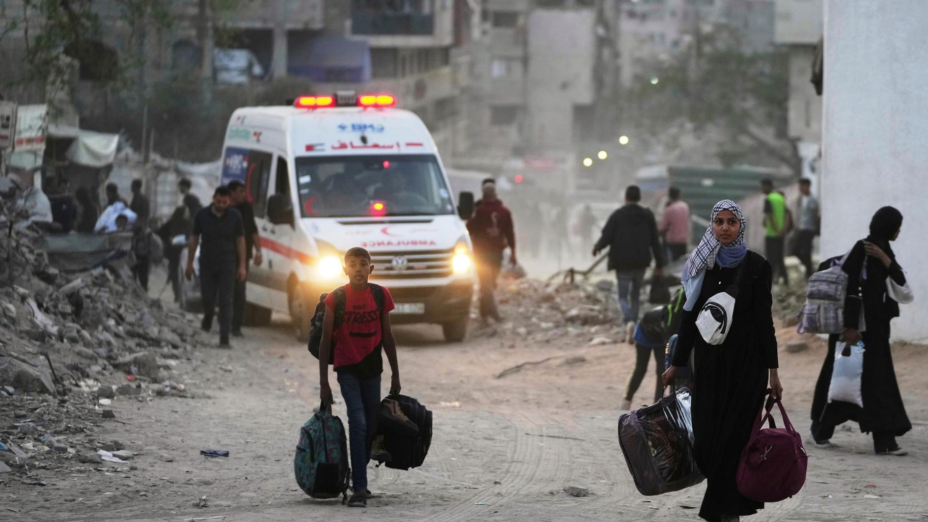 Gaza air strikes kill 94 as manhunt unfolds in West Bank