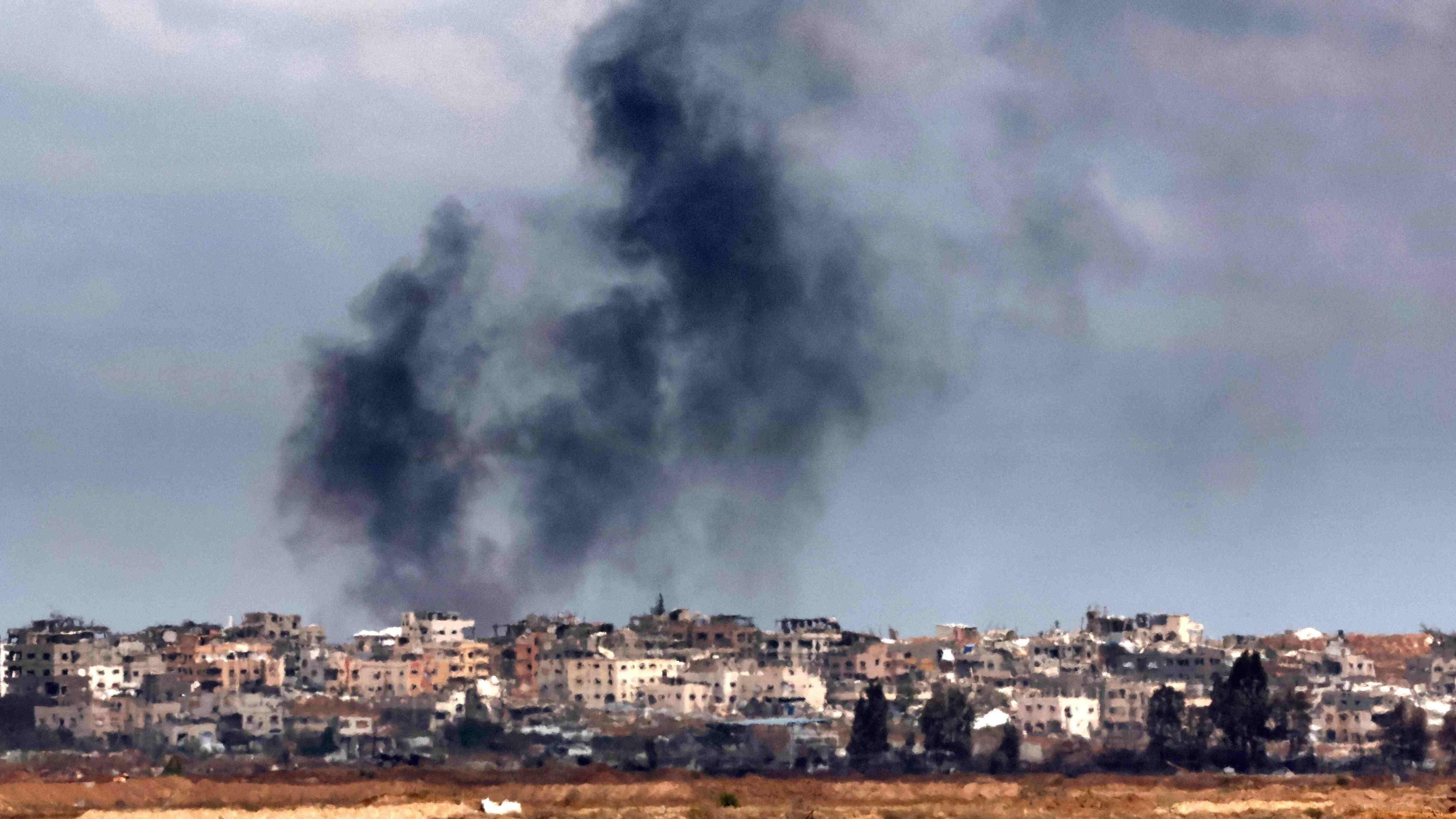 Israeli fire kills dozens in Gaza, six near aid centre