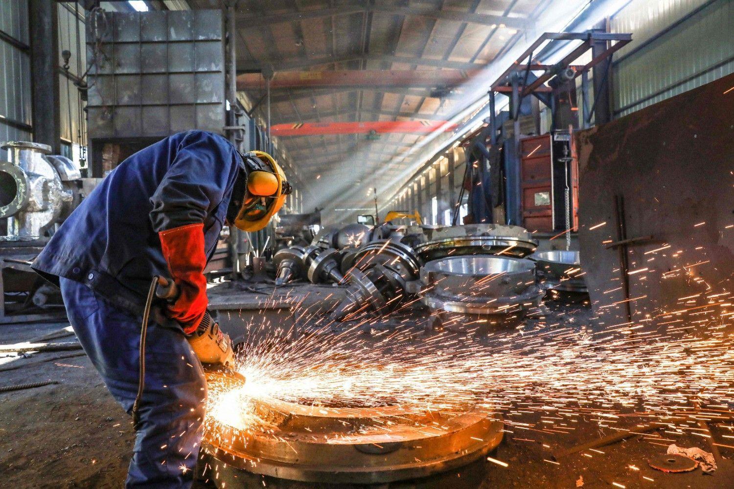 China factory output slumps in May as trade war pressures bit
