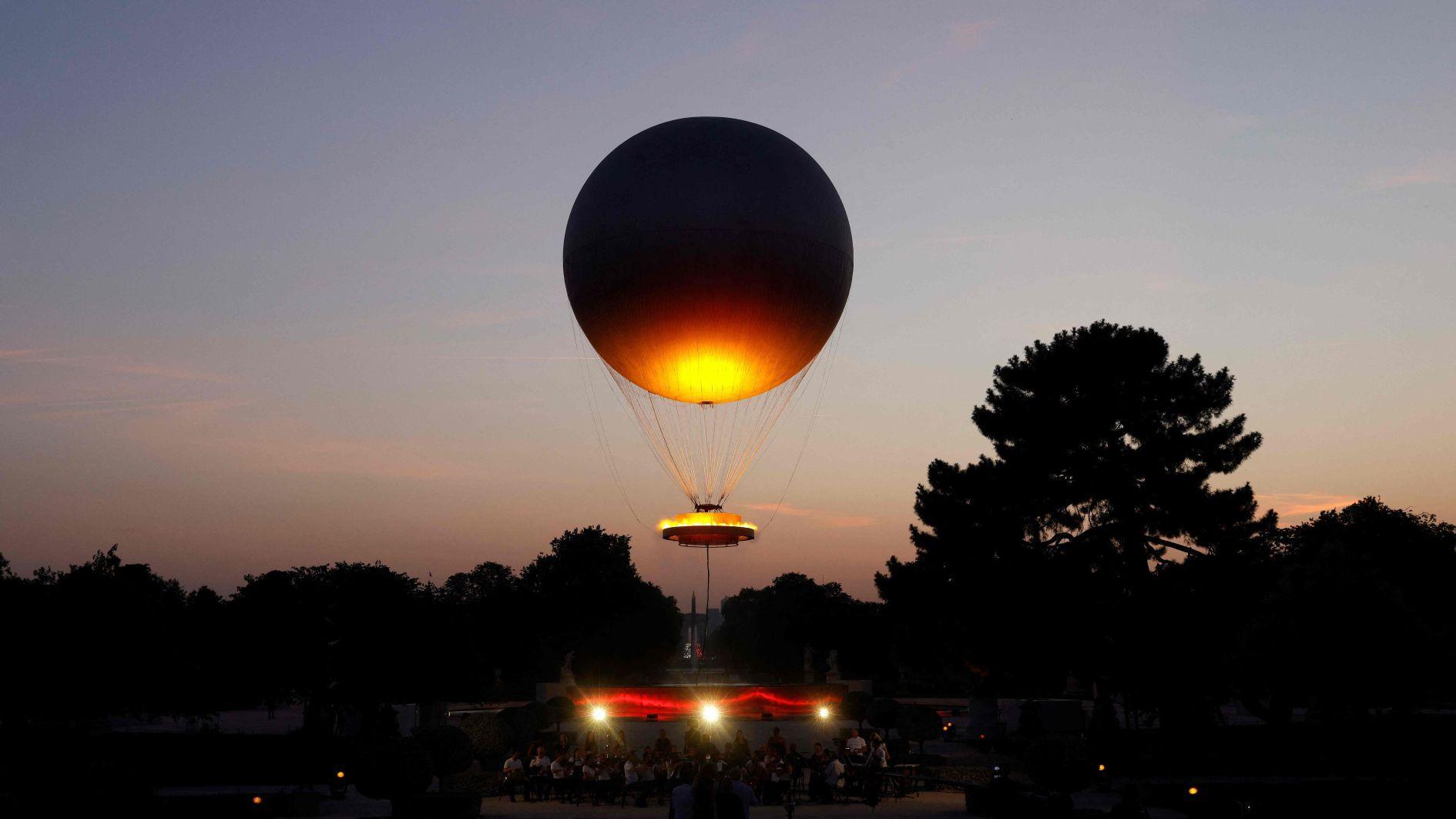 Paris iconic cauldron returns to light up summer nights