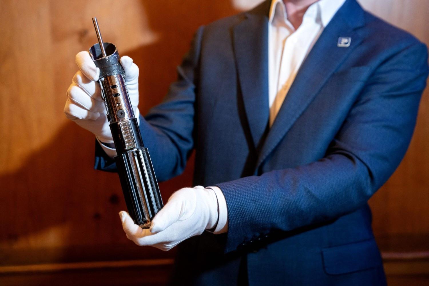 Darth Vader’s iconic lightsaber to go on auction in US