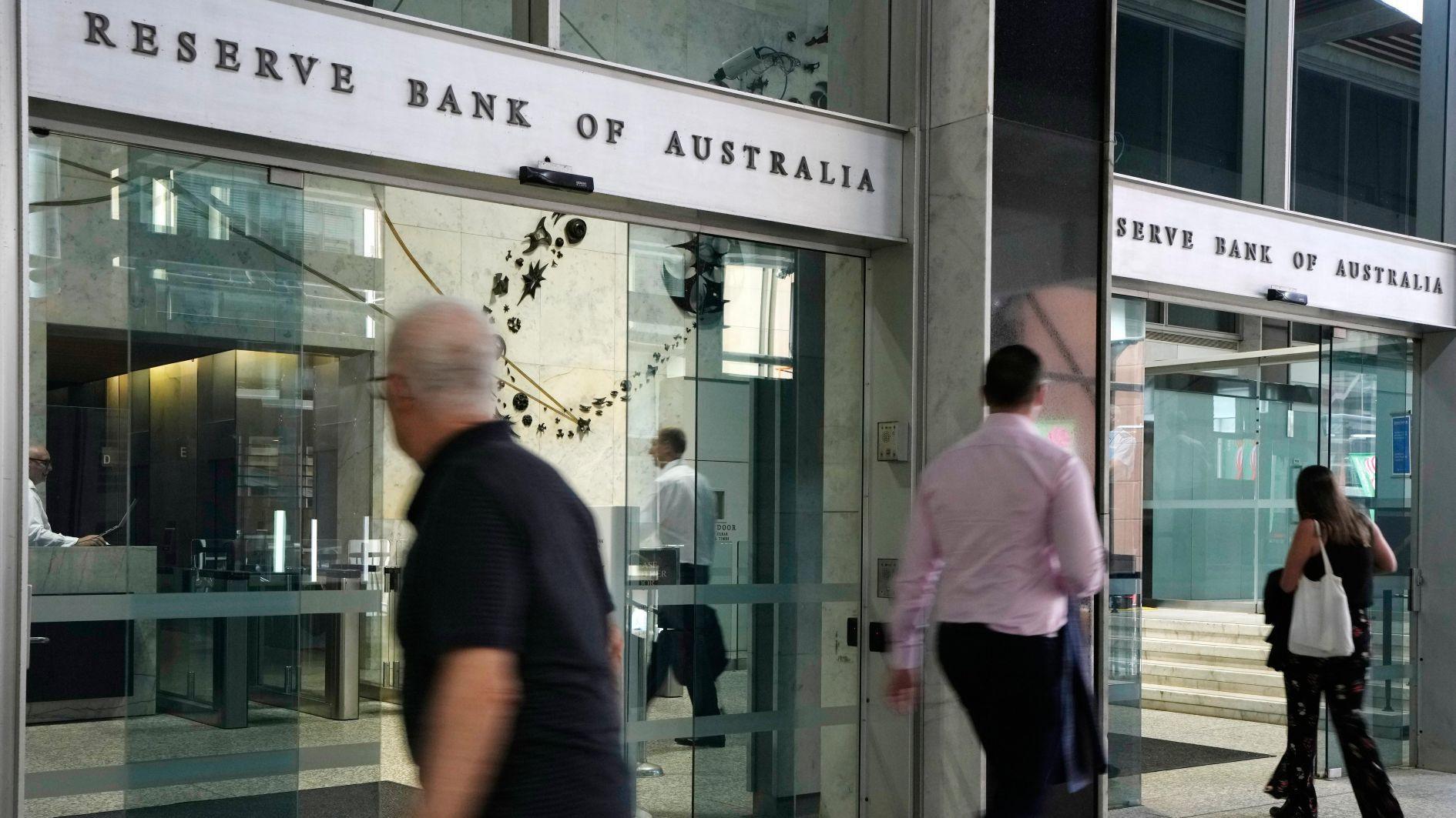 Australian central bank cuts key rate, warns of uncertainty