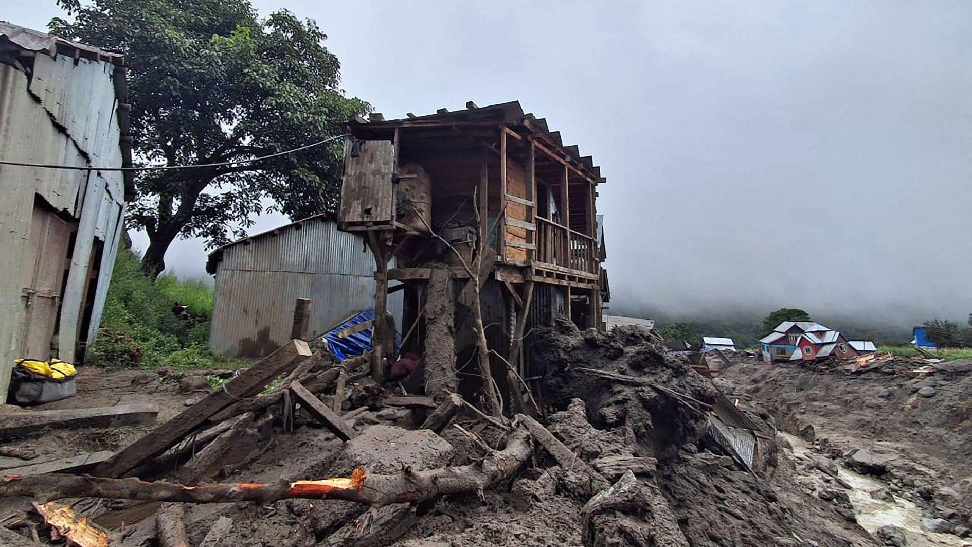 Indian rescuers scour debris after 60 killed in flood